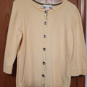 Yellow sweater with bee buttons.